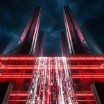 Digital image of a futuristic red and black architectural structure at night, featuring tall towers and a central waterfall of glowing binary code, interspersed with small white padlock icons.